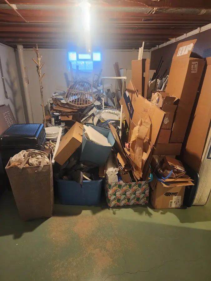 Roll-off dumpster container at job site for 2 Yard Dumpster Rental in Port Washington North